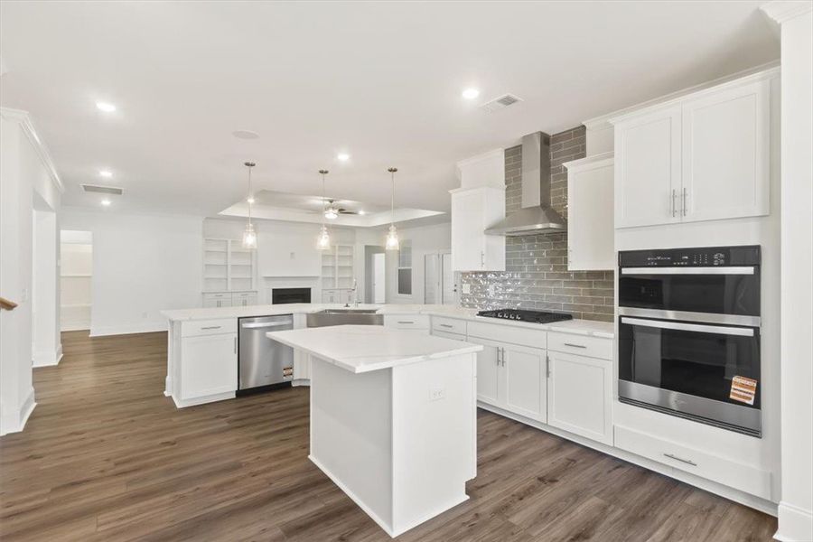 Gleaming hardwood floors and a spacious island anc