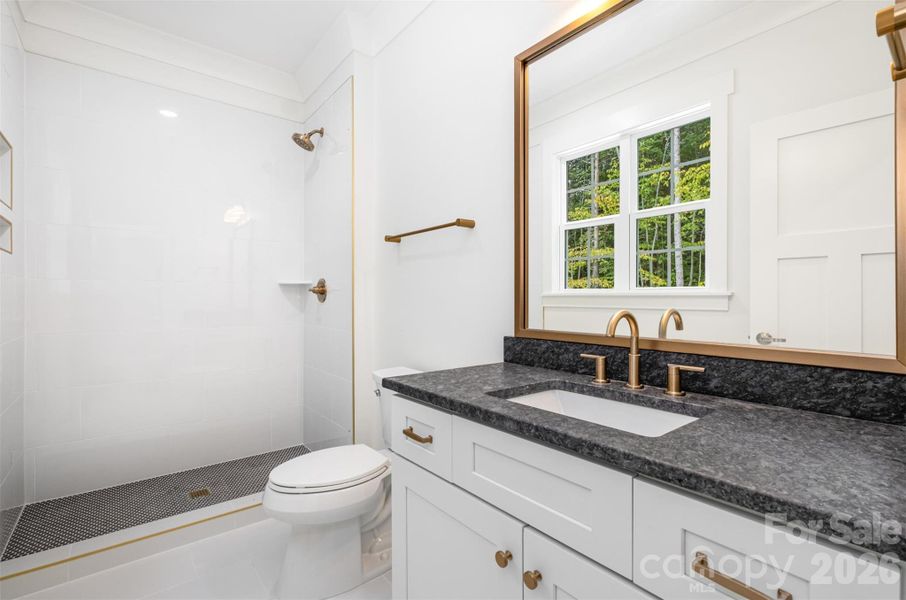 Second primary suite bath on main floor Second primary suite bath on main floor