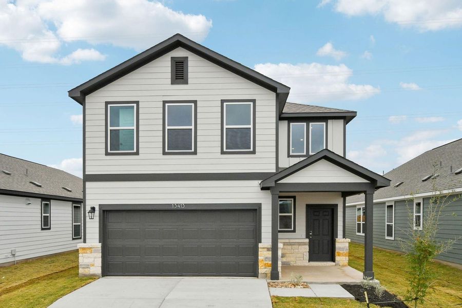 Front exterior of a new home in Stallion Run, Buda, TX, highlighting curb appeal (Image 20).