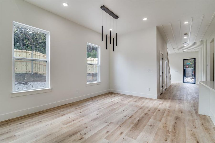 Spare room featuring light wood-style flooring and recessed lighting