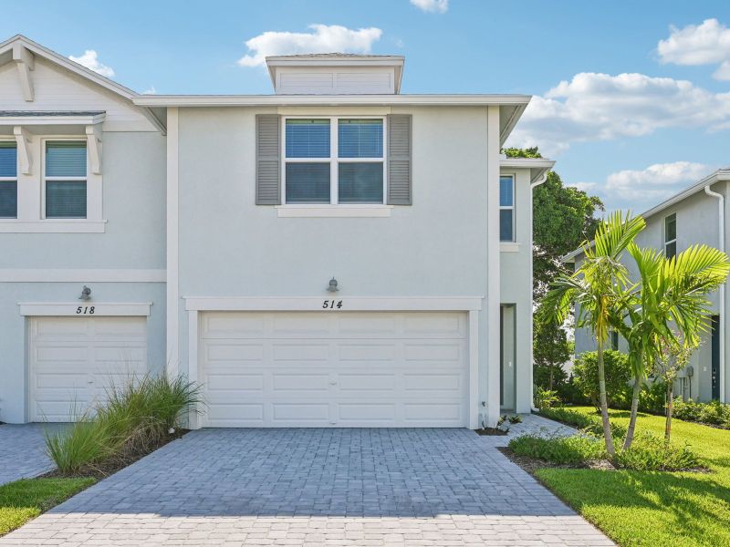 Front exterior of a new home in Tidewater, Fort Pierce, FL, highlighting curb appeal (Image 21).