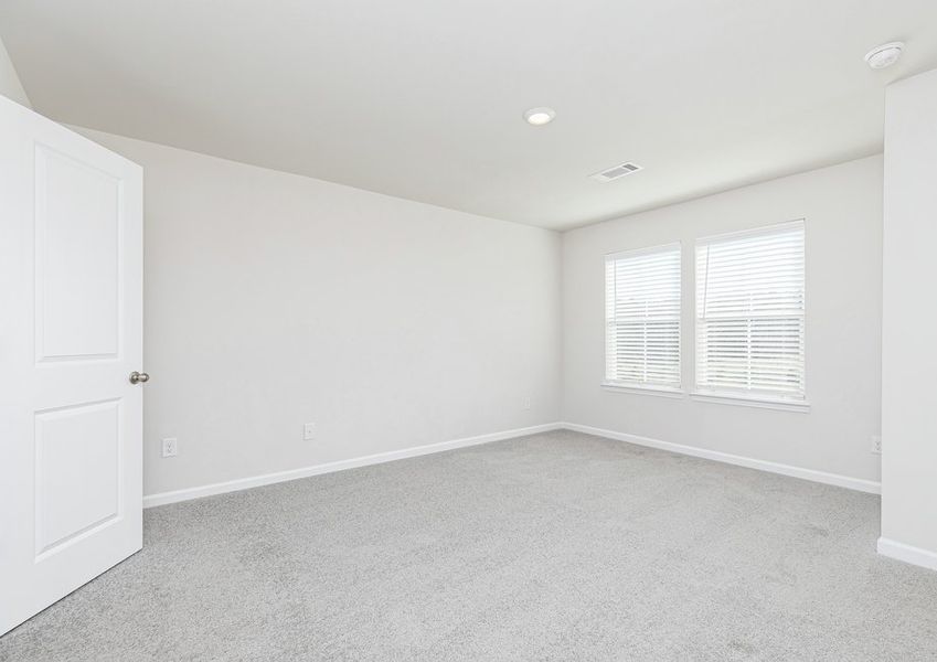 Unwind after a long day in the master bedroom