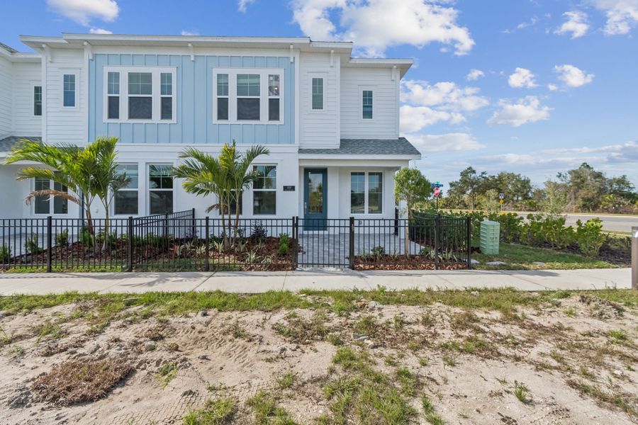 Exterior details and patio area of a home in Emerald Landing at Waterside at Lakewood Ranch – Towns, Sarasota (Image 3).