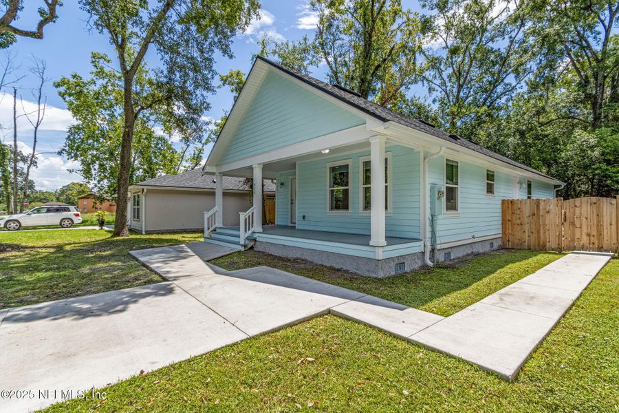 Front exterior of a new home in , Jacksonville, FL, highlighting curb appeal (Image 20).
