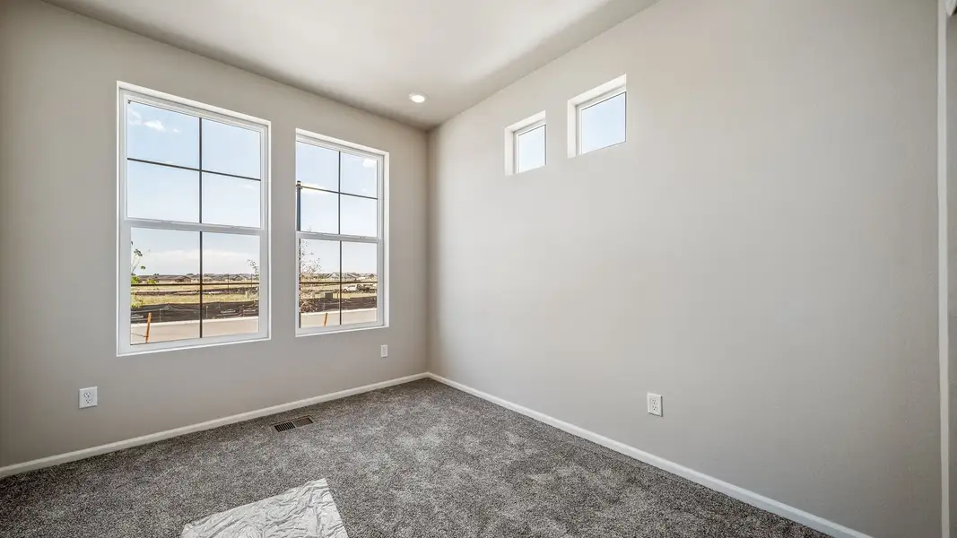 Spacious, unfurnished interior of a new home in The Reserve at Green Valley Ranch, Aurora (Image 23).