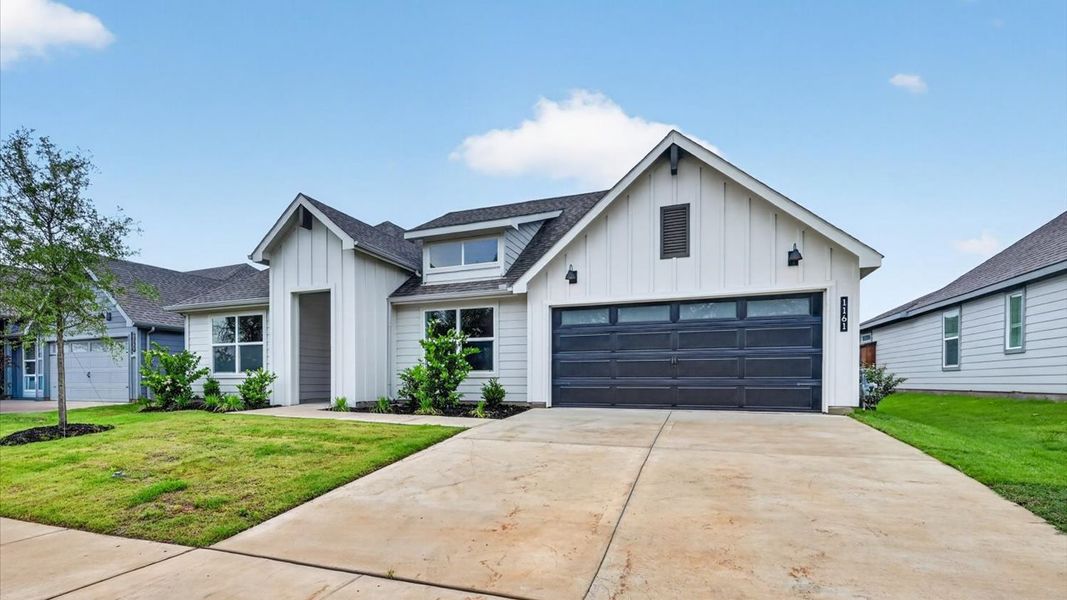 Front exterior of a new home in Sandstone Estates, Granbury, TX, highlighting curb appeal (Image 19). Front exterior of a new home in Sandstone Estates, Granbury, TX, highlighting curb appeal (Image 19).