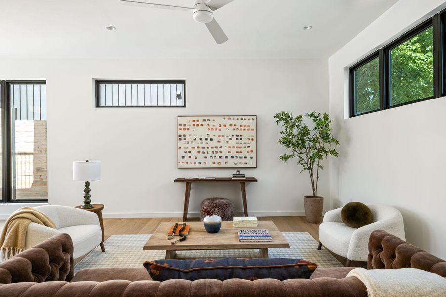 Clean lines and warm hardwood floors define this inviting contemporary living space.