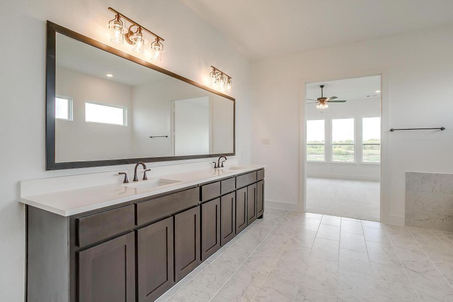 Representative furnished interior of a home built from the Livingston by Graham Hart Home Builder in Winding Creek, Keller (Image 10).