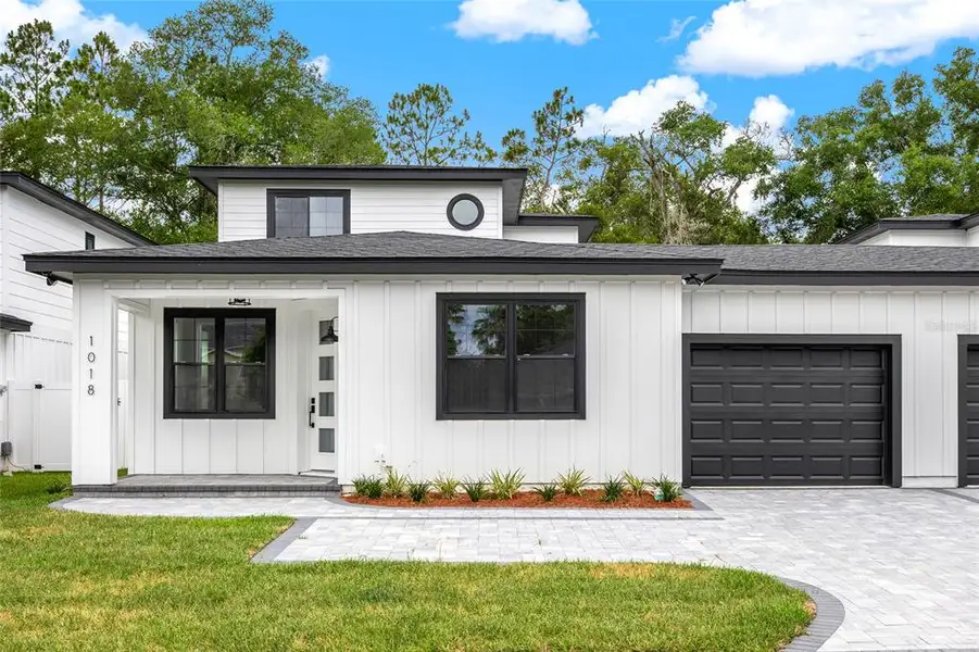Front exterior of a new home in , Eustis, FL, highlighting curb appeal (Image 1). Front exterior of a new home in , Eustis, FL, highlighting curb appeal (Image 1).