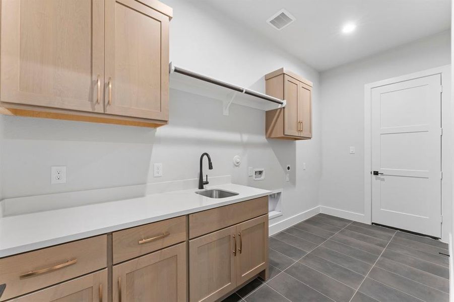 Utility Room with Sink and Additional Storage Cabinets