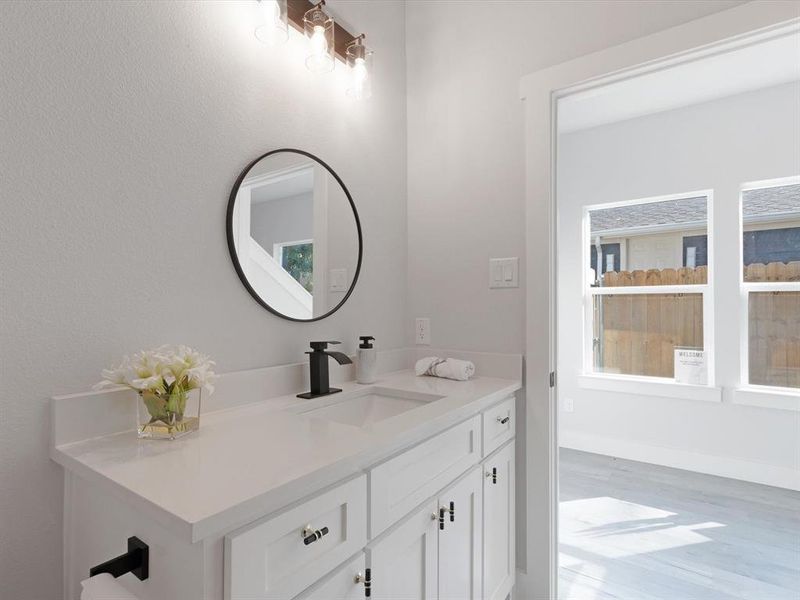 Bathroom featuring wood-type flooring and vanity