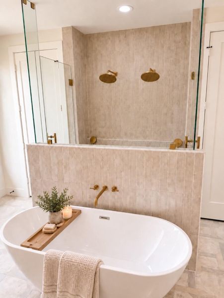 Freestanding tub and dual entry shower either double shower head