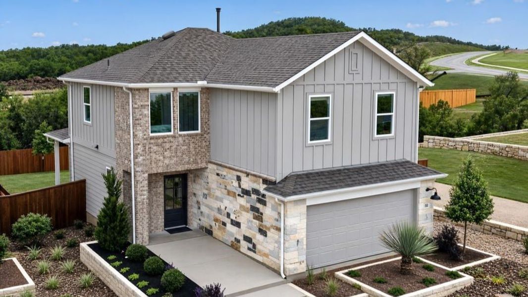 Representative exterior photo of a completed home built from the Harrier by Taylor Morrison in Village Grove, Dripping Springs, TX (Image 1). Representative exterior photo of a completed home built from the Harrier by Taylor Morrison in Village Grove, Dripping Springs, TX (Image 1).