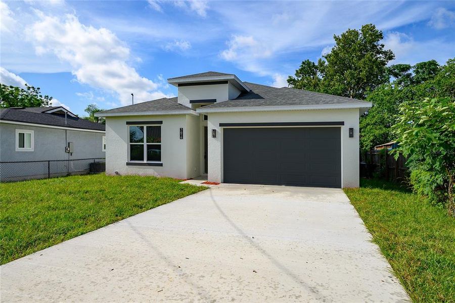 Front exterior of a new home in , Orlando, FL, highlighting curb appeal (Image 2).