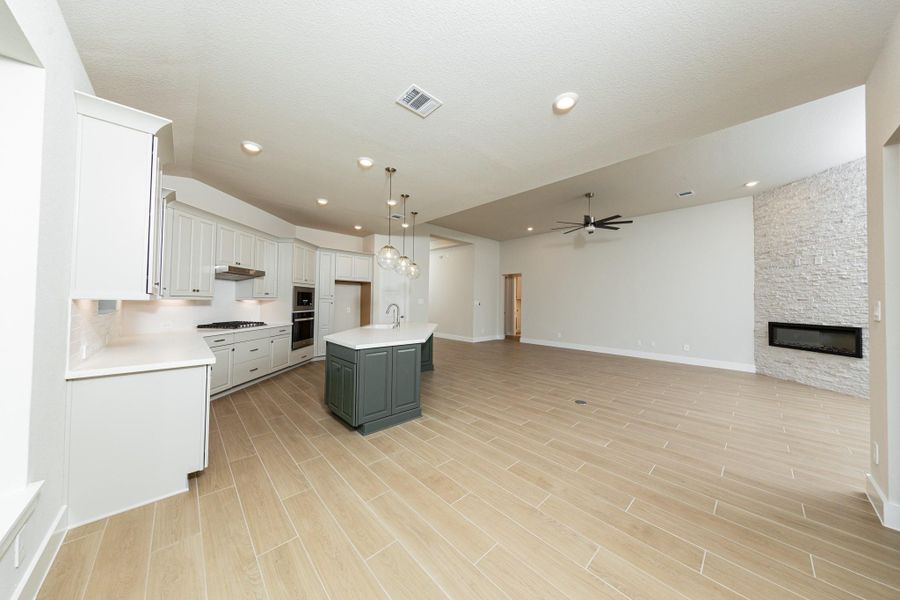 Stunning open-concept design seamlessly connecting the living, dining, and kitchen areas—perfect for both everyday living and entertaining!