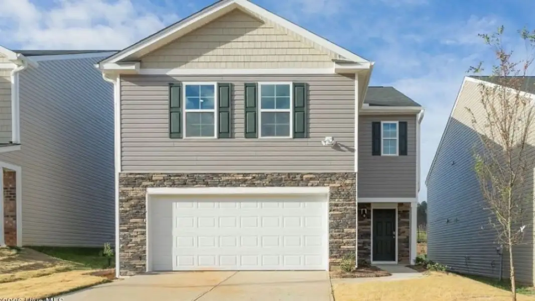 Front exterior of a new home in Carter Ridge, Greenville, NC, highlighting curb appeal (Image 1). Front exterior of a new home in Carter Ridge, Greenville, NC, highlighting curb appeal (Image 1).