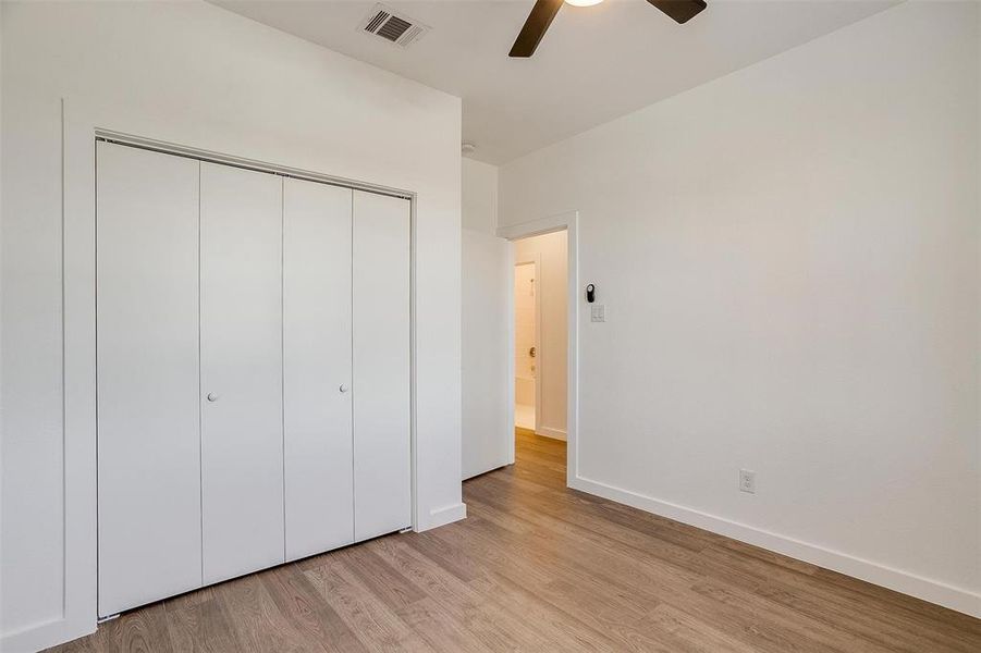 Bedroom 3 bedroom with ceiling fan, a closet, and light hardwood / wood-style flooring Bedroom 3 bedroom with ceiling fan, a closet, and light hardwood / wood-style flooring