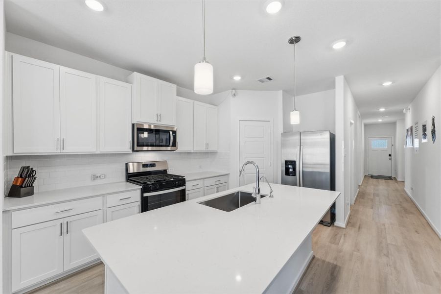 Spacious kitchen with island & stainless steel appliances Spacious kitchen with island & stainless steel appliances