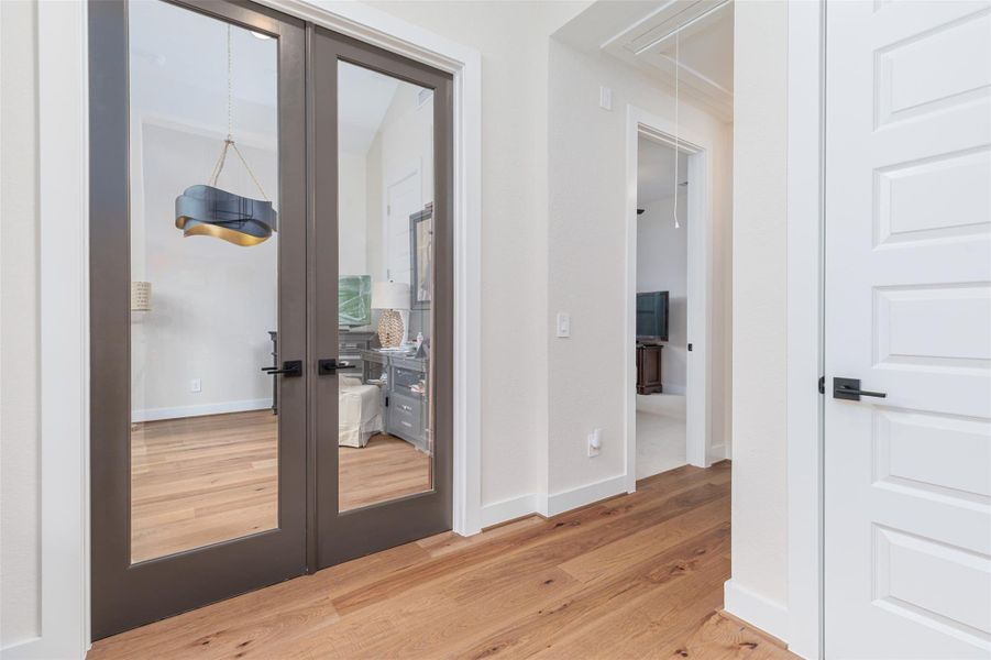 The dedicated private study is located immediately to the left of the principal entry to the home.  Housed behind the elegant double glass doors, this spacious home office makes working at home a breeze.