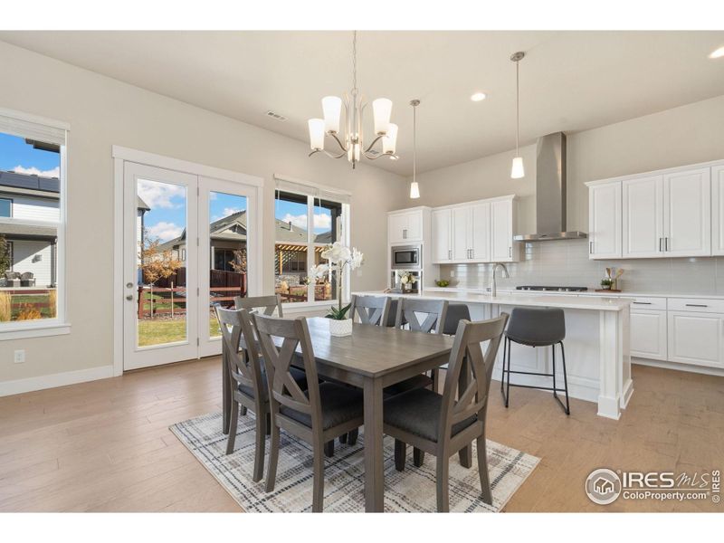 Dining area opens to a covered back patio with gas grill hookup for effortless indoor-outdoor living!