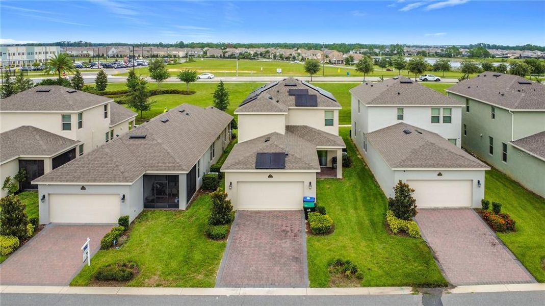 Front exterior of a new home in , Winter Garden, FL, highlighting curb appeal (Image 1).