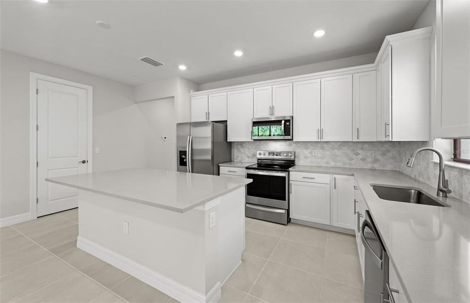Furnished interior view inside a new home in Cedar Grove at The Woodlands, North Port (Image 4).