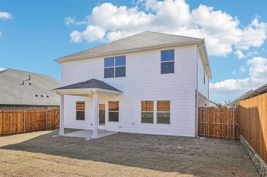 Back of house featuring a patio area and a fenced backyard Back of house featuring a patio area and a fenced backyard