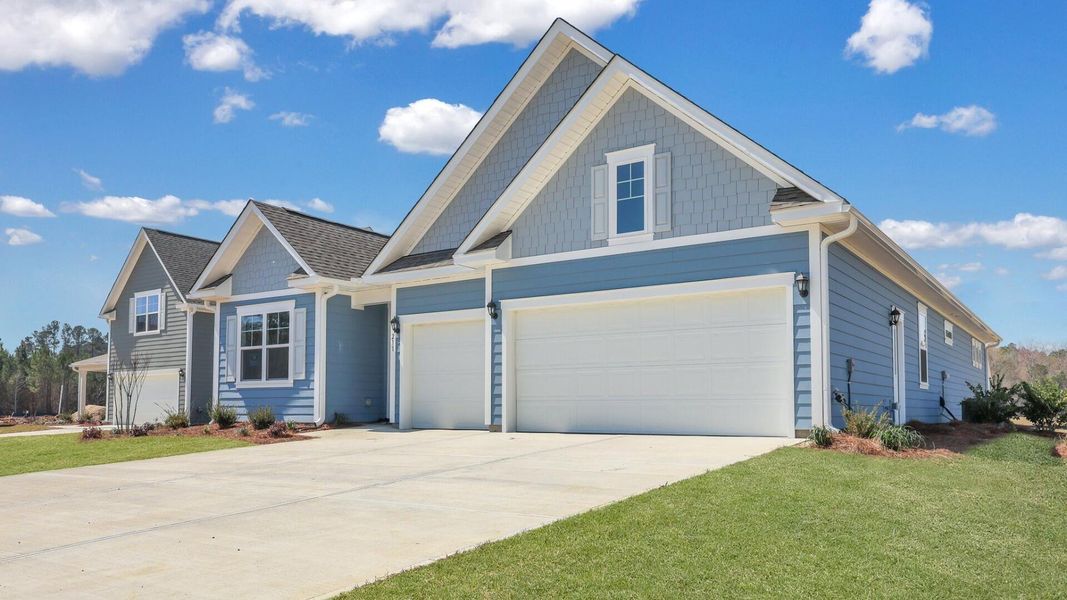 Front exterior of a new home in Berkeley Bay, Ridgeville, SC, highlighting curb appeal (Image 1).