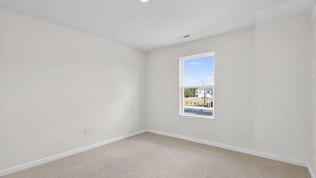 Spacious, unfurnished interior of a new home in The Townes at Honeycutt Oaks, Angier (Image 25).