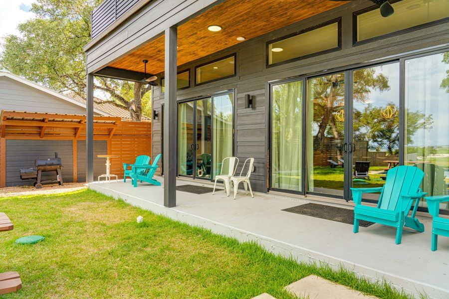 Unwind on the covered back patio with peaceful Hill Country views and a spacious yard perfect for entertaining or soaking in the Canyon Lake breeze. A serene setting for morning coffee or evening sunsets. Unwind on the covered back patio with peaceful Hill Country views and a spacious yard perfect for entertaining or soaking in the Canyon Lake breeze. A serene setting for morning coffee or evening sunsets.