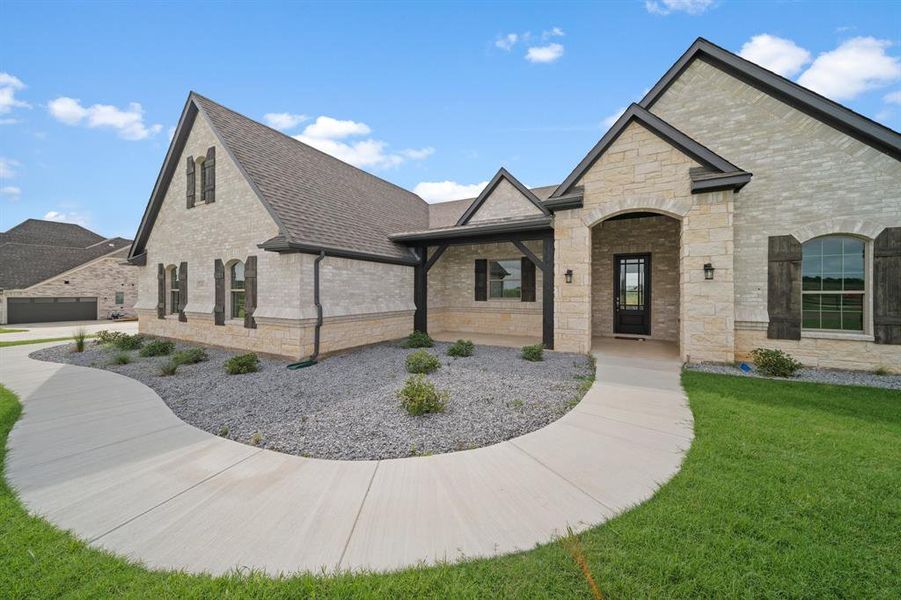 View of front of property with a front yard