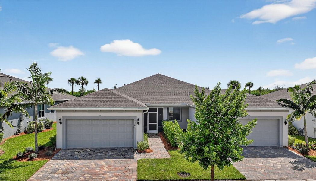 Front exterior of a new home in , Port St. Lucie, FL, highlighting curb appeal (Image 2).