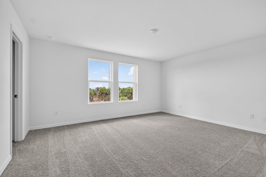 Representative unfurnished interior of a home built from the Sebago by Ashton Woods in Catamaran Cove, Rockledge (Image 9).