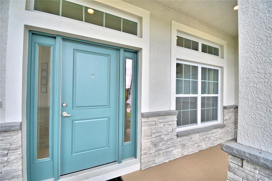 Exterior details and patio area of a home in Cadence Crossing, Auburndale (Image 2).