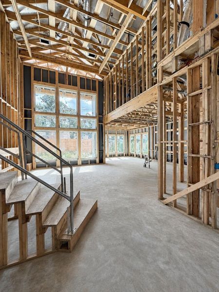 Living Area That Features High Ceilings. Construction photo as of 08/18/2026