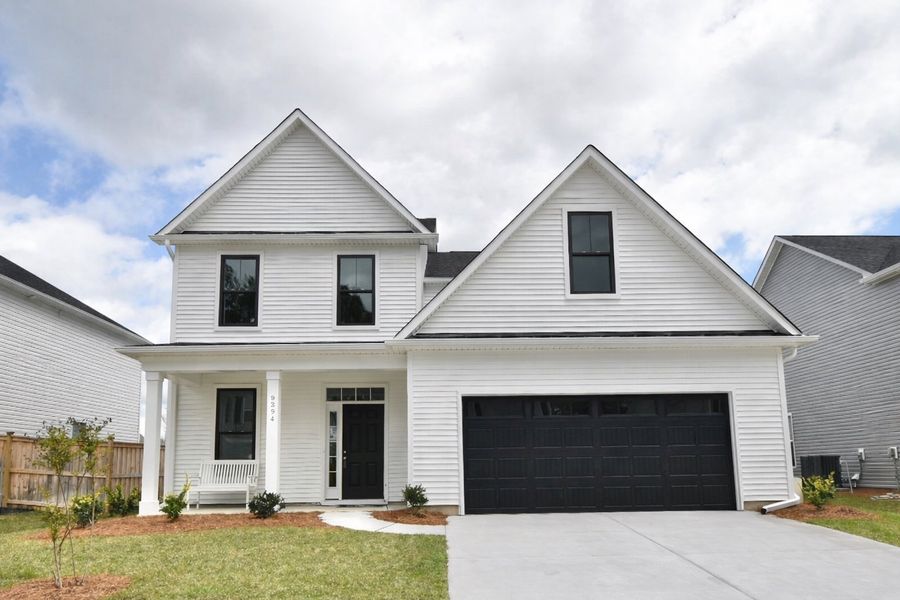 Front exterior of a new home in Sawyer’s Run, Hampstead, NC, highlighting curb appeal (Image 1). Front exterior of a new home in Sawyer’s Run, Hampstead, NC, highlighting curb appeal (Image 1).