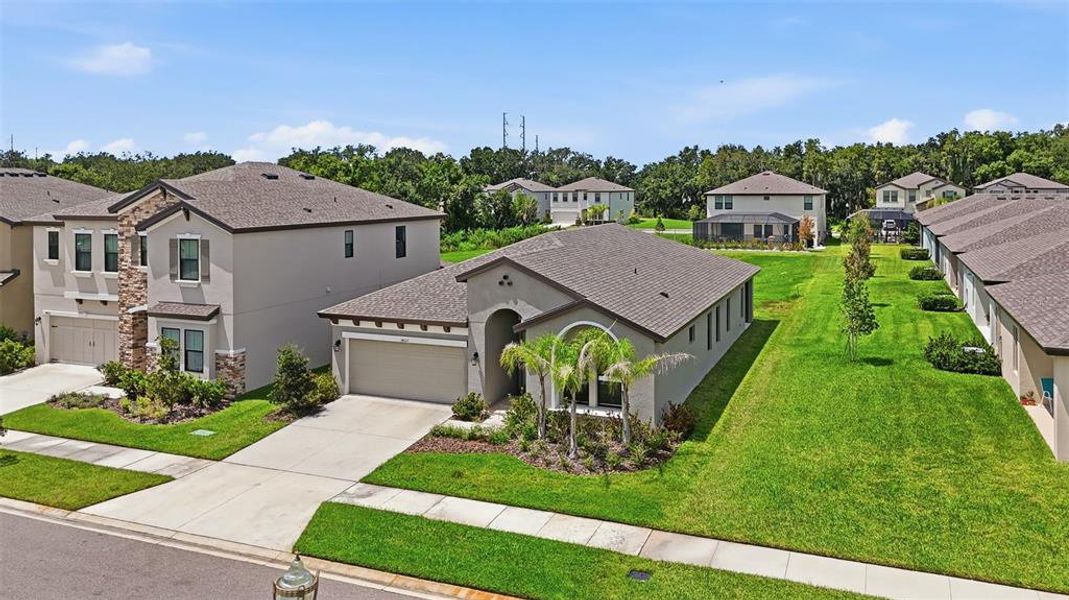 Front exterior of a new home in Hawkstone, Lithia, FL, highlighting curb appeal (Image 23).