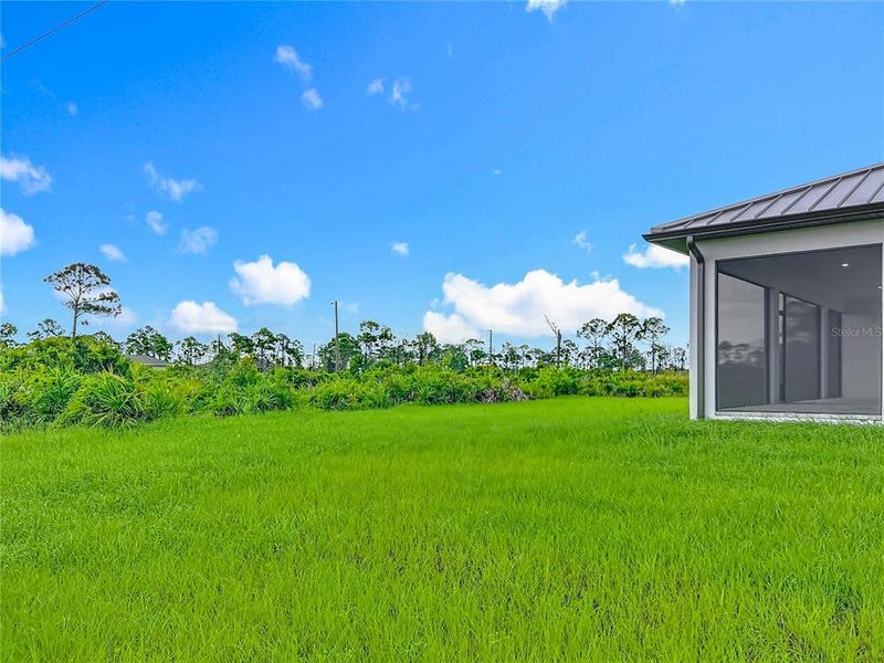 Front exterior of a new home in , Placida, FL, highlighting curb appeal (Image 26). Front exterior of a new home in , Placida, FL, highlighting curb appeal (Image 26).