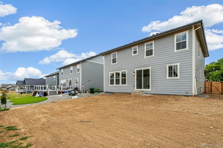 Front exterior of a new home in Windsong, Thornton, CO, highlighting curb appeal (Image 19).