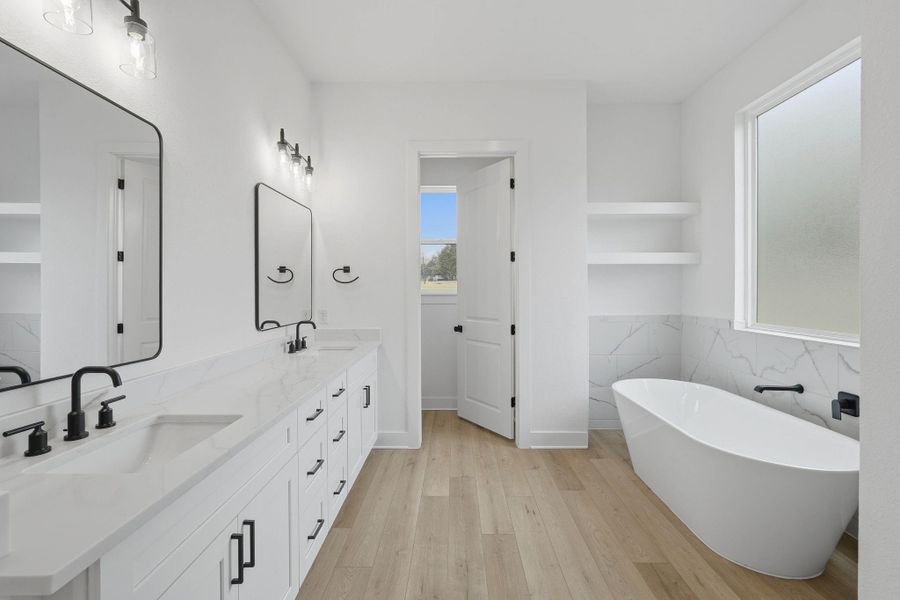 Double vanity with modern fixtures and generous counter space.