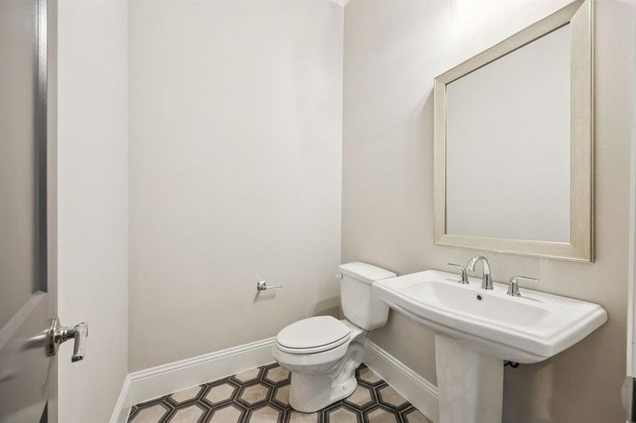 Half bathroom on first floor. Half bathroom on first floor.