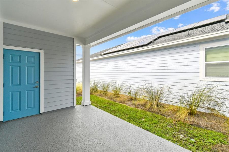 Exterior details and patio area of a home in Weslyn Park in Sunbridge 34', St. Cloud (Image 2).