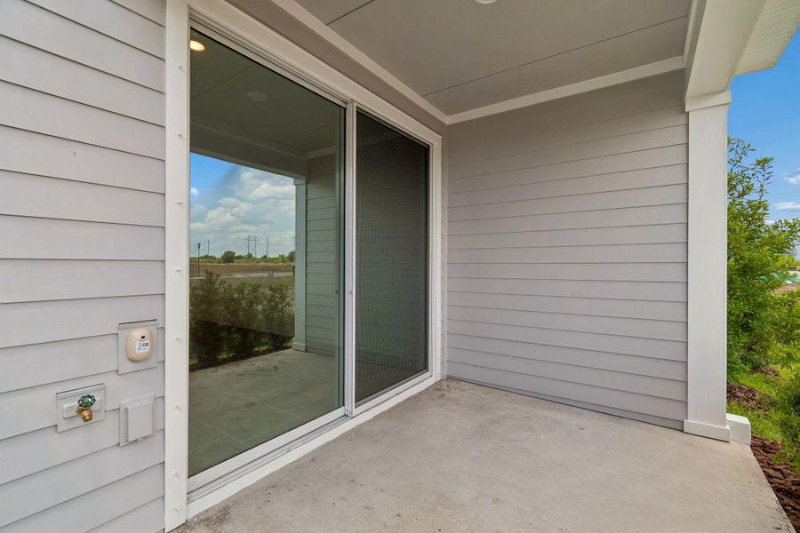 Exterior details and patio area of a home in Waterset Townhomes, Apollo Beach (Image 3).