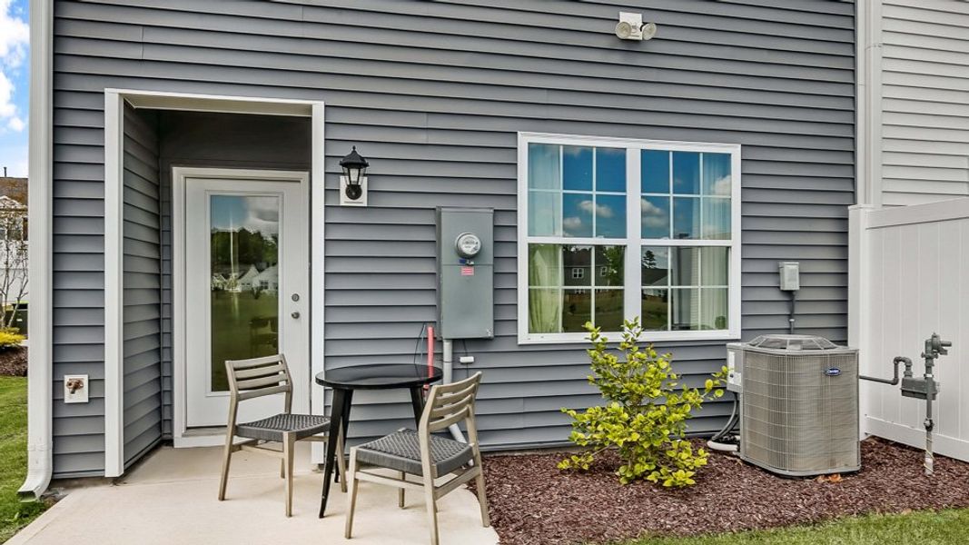 Exterior details and patio area of a home in The Townes at Prestleigh, Wake Forest (Image 3). Exterior details and patio area of a home in The Townes at Prestleigh, Wake Forest (Image 3).