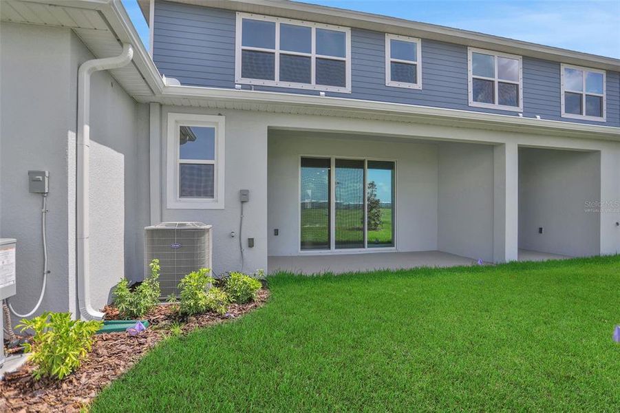 Exterior details and patio area of a home in Seaire, Parrish (Image 4).
