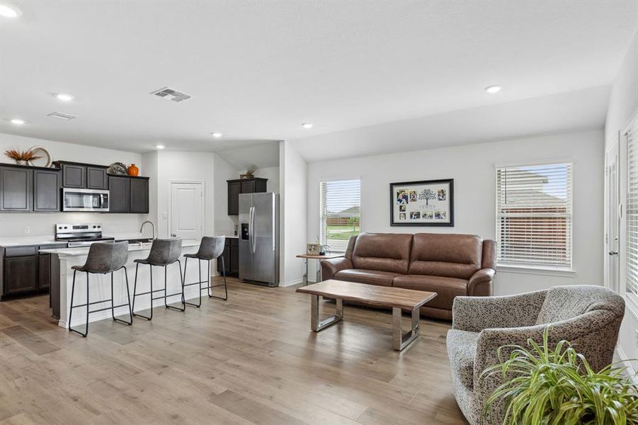 Living room featuring recessed lighting and light wood finished floors Living room featuring recessed lighting and light wood finished floors