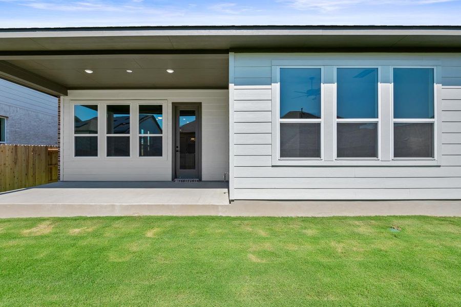 Front exterior of a new home in Arbor Collection at Lariat, Liberty Hill, TX, highlighting curb appeal (Image 17). Front exterior of a new home in Arbor Collection at Lariat, Liberty Hill, TX, highlighting curb appeal (Image 17).