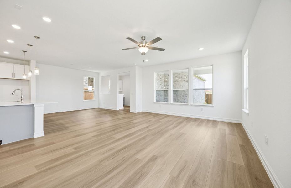 Open concept gathering room creating a spacious and inviting atmosphere *Real home pictured Open concept gathering room creating a spacious and inviting atmosphere *Real home pictured