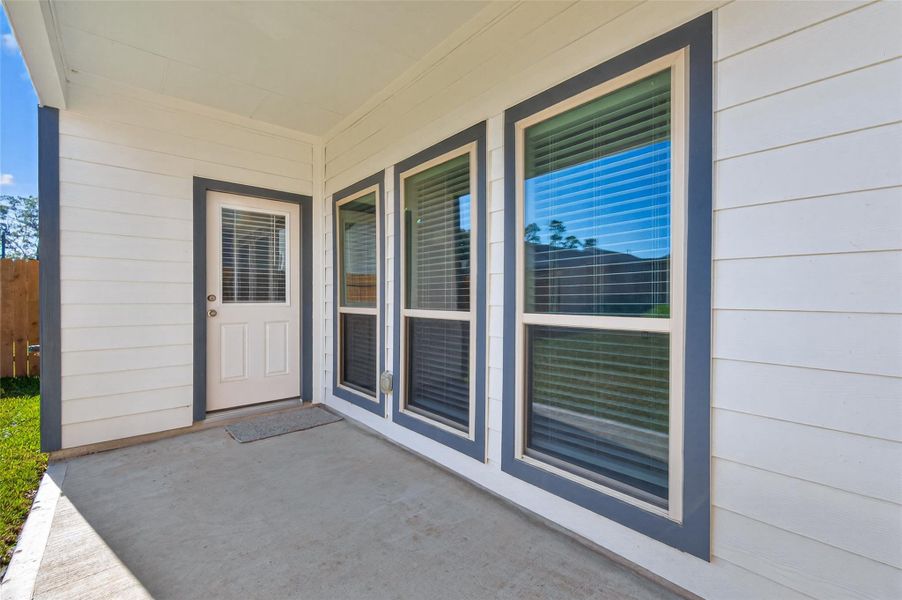 Exterior details and patio area of a home in Woodland Lakes, Huffman (Image 27). Exterior details and patio area of a home in Woodland Lakes, Huffman (Image 27).
