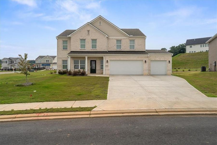 Front exterior of a new home in , Calhoun, GA, highlighting curb appeal (Image 24). Front exterior of a new home in , Calhoun, GA, highlighting curb appeal (Image 24).